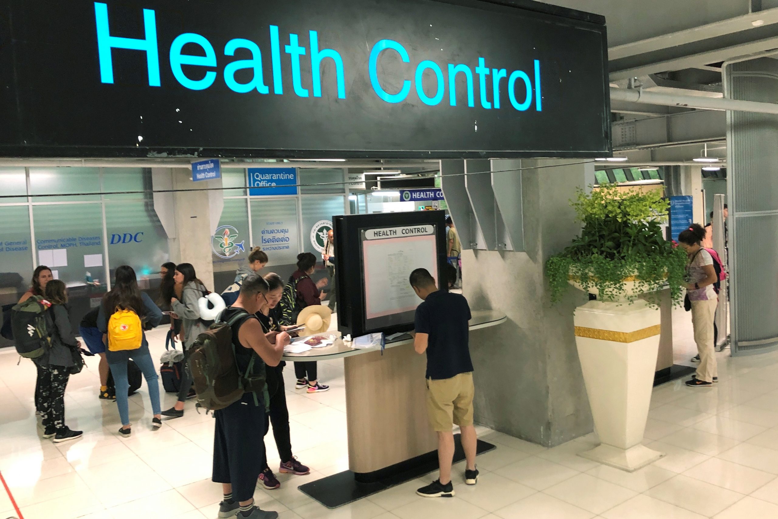 Tourist line-up in a health control at the arrival section at Suvarnabhumi international airport in Bangkok, Thailand