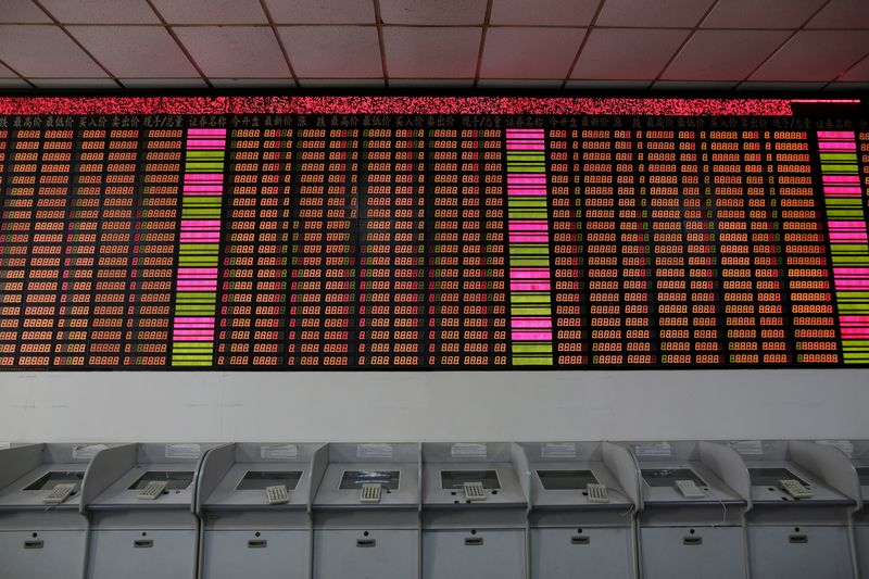 An electronic stock information board displaying zero numbers on the latests stock prices before the opening of the first trading day after the week-long Lunar New Year holiday at a brokerage house in Shanghai