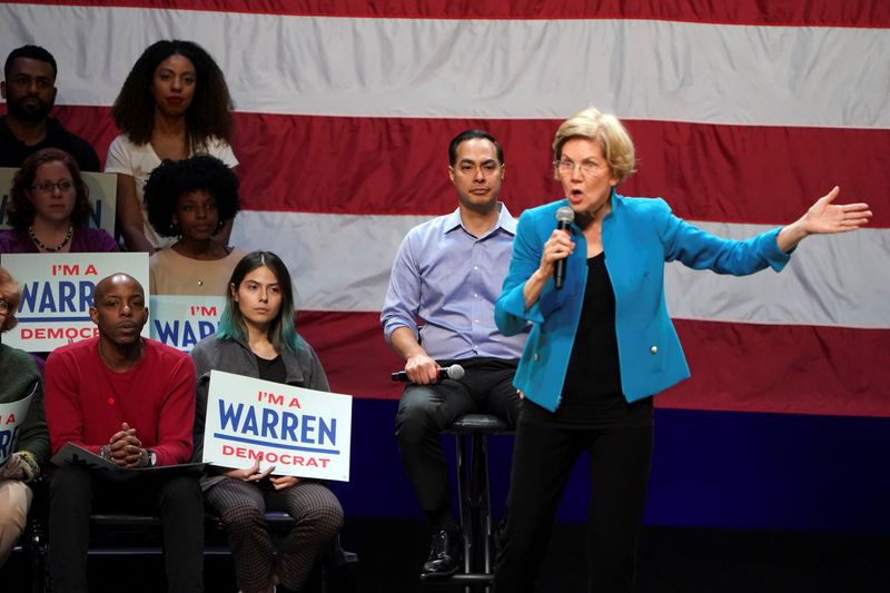 Former Democratic U.S. presidential candidate Julian Castro and supporters listen as Democratic U.S. presidential candidate and Senator Elizabeth Warren speaks at her campaign event at Brooklyn's Kings Theatre in New York