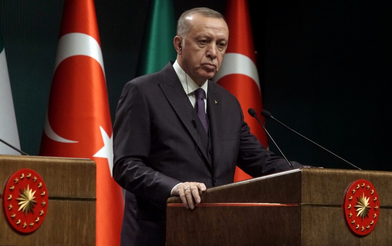 FILE PHOTO: Turkish President Tayyip Erdogan attends a news conference in Ankara