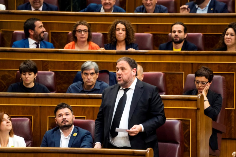 FILE PHOTO: Jailed Catalan politician Oriol Junqueras takes the oath as a deputy during the first session of parliament following a general election in Madrid