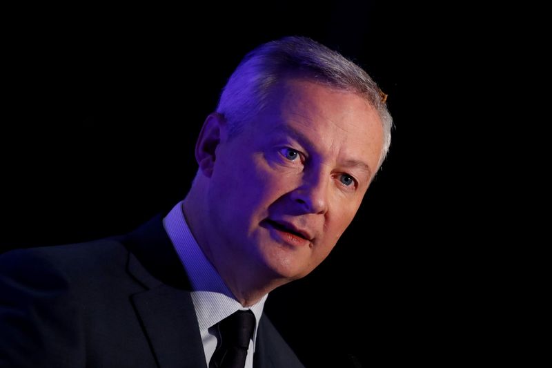 FILE PHOTO: French Finance Minister Bruno Le Maire attends a news conference in Boulogne-Billancourt