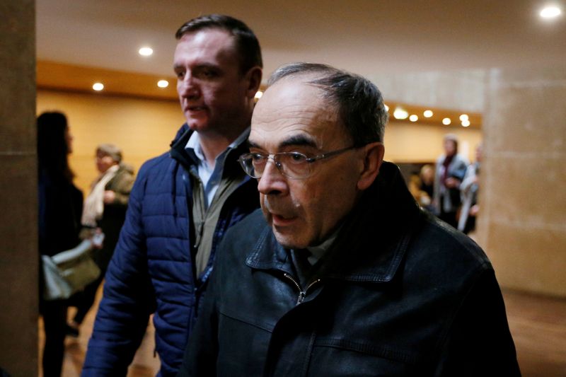 FILE PHOTO: Cardinal Philippe Barbarin, Archbishop of Lyon, walks inside the courthouse during a break on the last day of his trial at the courthouse in Lyon