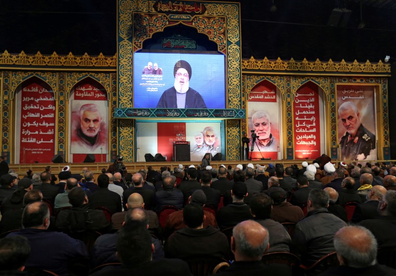 FILE PHOTO: Lebanon's Hezbollah leader Sayyed Hassan Nasrallah addresses his supporters via a screen during a funeral ceremony rally to mourn Qassem Soleimani, head of the elite Quds Force, who was killed in an air strike at Baghdad airport, in Beirut's su