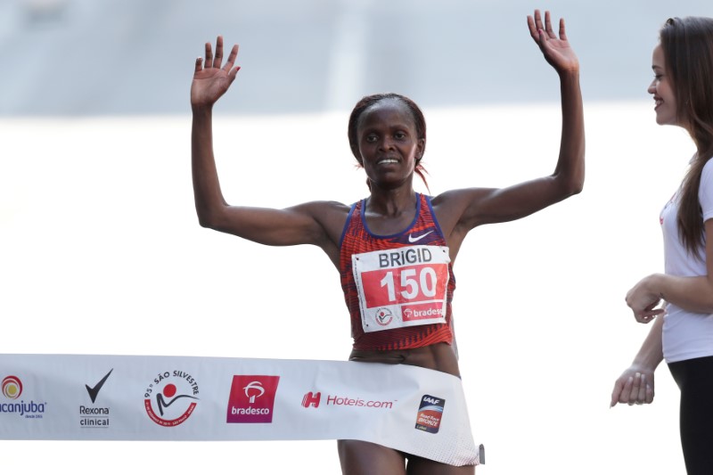 Kenya's Brigid Jepchirchir Kosgei crosses the finish line to win the annual 