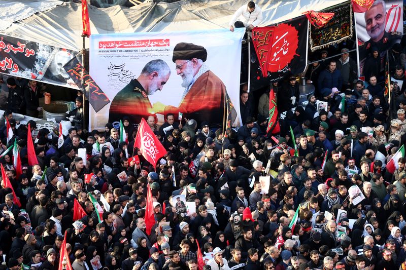 Iranian people attend a funeral procession for Iranian Major-General Qassem Soleimani, head of the elite Quds Force, and Iraqi militia commander Abu Mahdi al-Muhandis, who were killed in an air strike at Baghdad airport, in Tehran