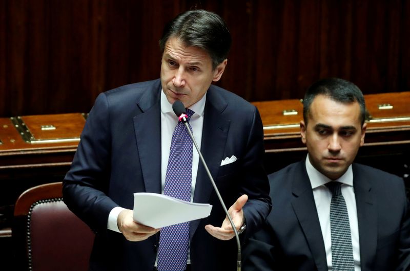 FILE PHOTO: Italian Prime Minister Giuseppe Conte presents his government's programme as 5-Star Movement leader Luigi di Maio sits next to him, ahead of confidence vote at the Parliament in Rome