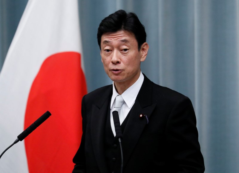 Japan's Economy Minister Nishimura attends a news conference at PM Abe's official residence in Tokyo
