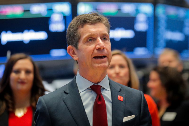 Alex Gorsky, Chairman and CEO of Johnson & Johnson, celebrates the 75th anniversary of his company's listing on the floor at the NYSE in New York