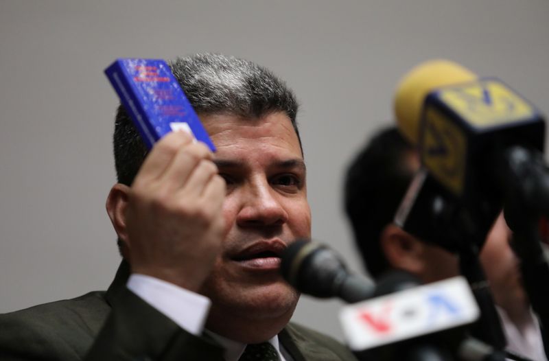 Venezuelan lawmaker Luis Parra speaks during a news conference in Caracas