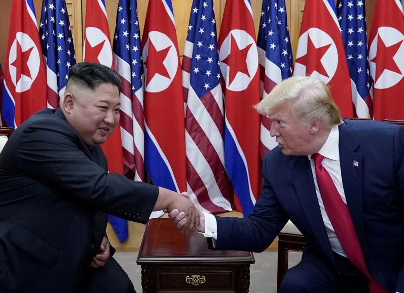 FILE PHOTO: U.S. President Trump and North Korean leader Kim Jong Un meet at the Korean Demilitarized Zone