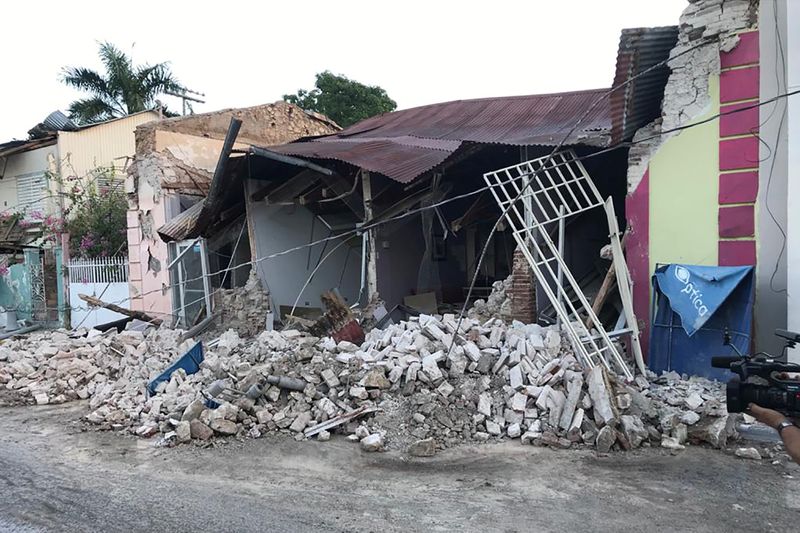 A home is seen collapsed after an earthquake in Guanica