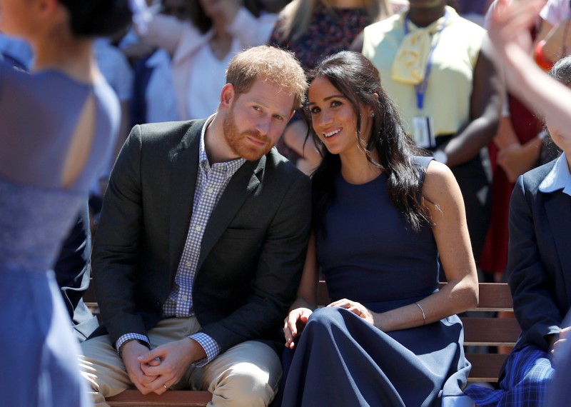 FILE PHOTO: Britain's Prince Harry and his wife Meghan, Duchess of Sussex, visit Macarthur Girls High School in Sydney