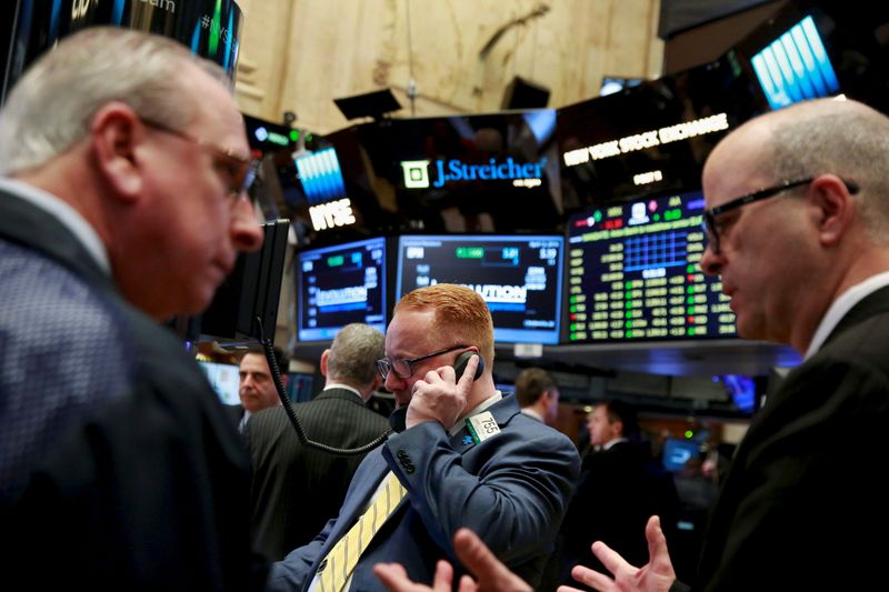 File photo of traders working on the floor of the New York Stock Exchange shortly after the opening bell in New York