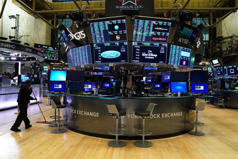 FILE PHOTO: A maintenance worker sweeps the floor at the New York Stock Exchange