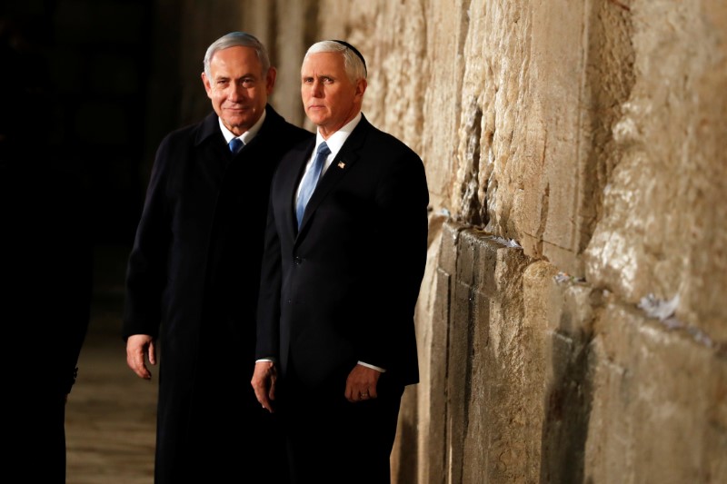 U.S Vice President Mike Pence stands next to Israeli Prime Minister Benjamin Netanyahu during a visit to the Western Wall, Judaism's holiest prayer site, in Jerusalem's Old City