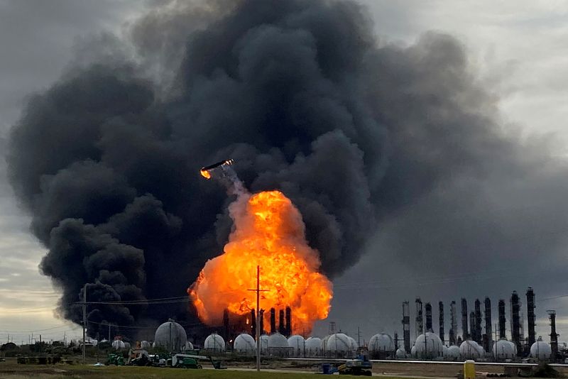FILE PHOTO: A process tower flies through the air after exploding at the TPC Group Petrochemical Plant in Port Neches