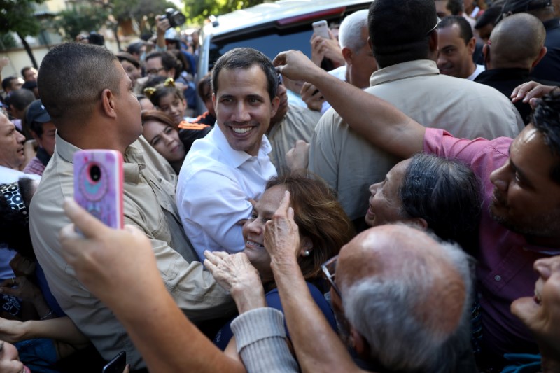 Juan Guaido, president of Venezuela's National Assembly share with supporters after a citizen assembly in Caracas