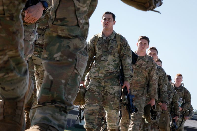 U.S. Army paratroopers assigned to 1st Brigade Combat Team, 82nd Airborne Division board an aircraft bound for the U.S. Central Command area of operations from Fort Bragg