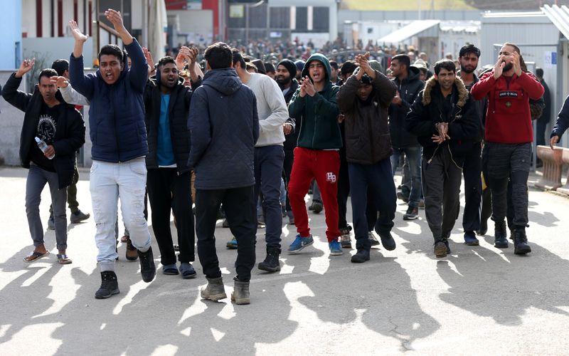 Migrants protest in front of the refugee camp Miral in Velika Kladusa