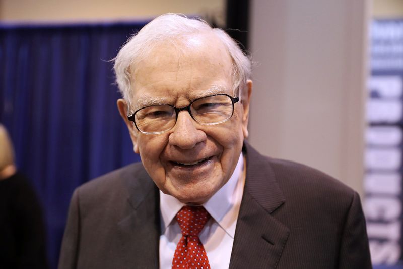 Berkshire Hathaway Chairman Warren Buffett walks through the exhibit hall as shareholders gather to hear from the billionaire investor at Berkshire Hathaway Inc's annual shareholder meeting in Omaha