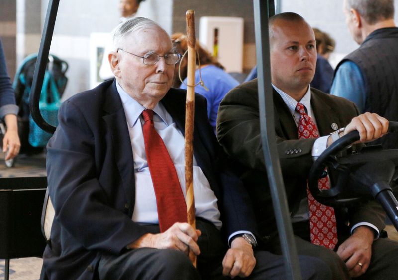 FILE PHOTO: Berkshire Hathaway vice chairman Charlie Munger visits the shareholder shopping day in Omaha