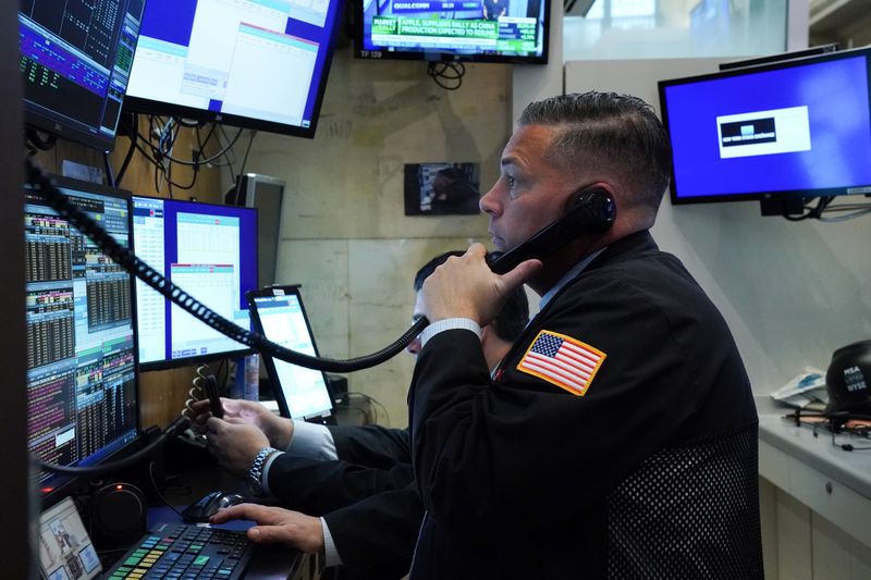 A trader works at the New York Stock Exchange