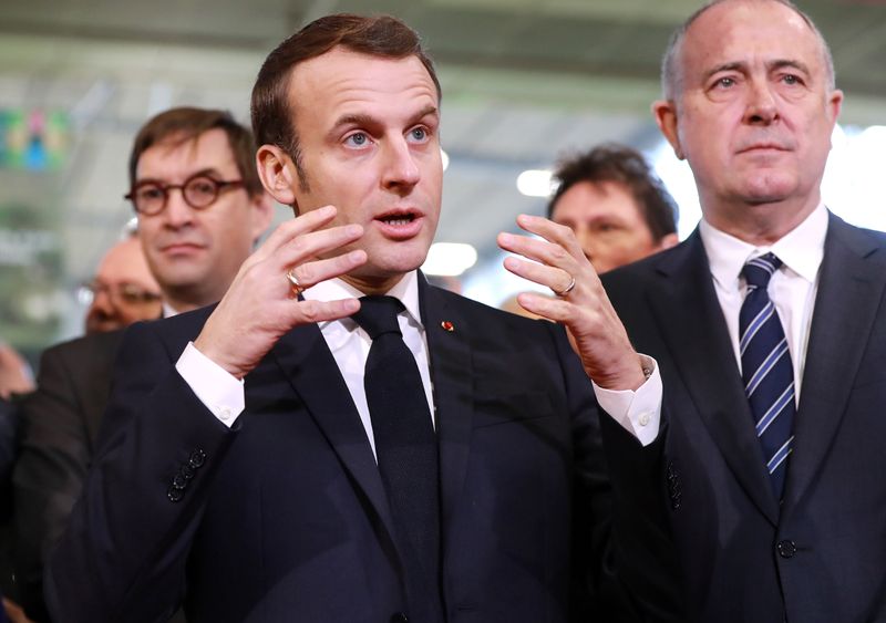 French President Emmanuel Macron gestures as he talks during the 57th International Agriculture Fair (Salon international de l'Agriculture) at the Porte de Versailles exhibition center in Paris