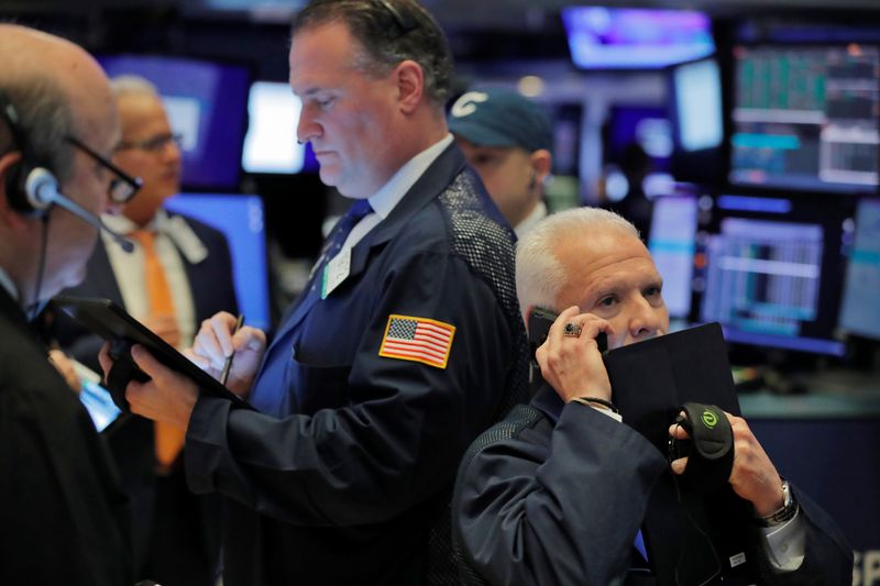 Traders work on the floor of the New York Stock Exchange shortly after the opening bell in New York