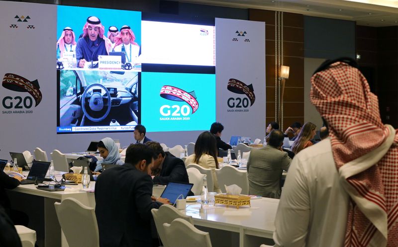 Journalists sit in the media center during the meeting of G20 finance ministers and central bank governors in Riyadh