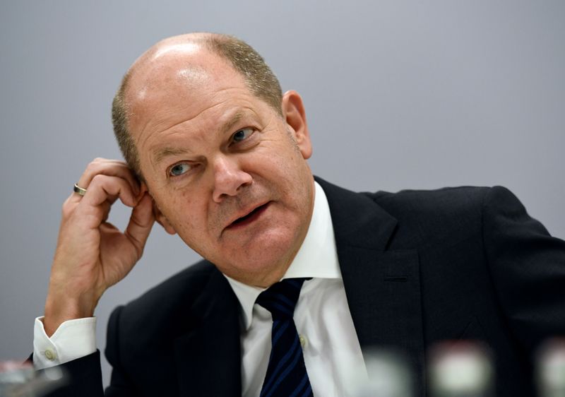FILE PHOTO: German Finance Minister Scholz speaks during an interview with Reuters in Berlin