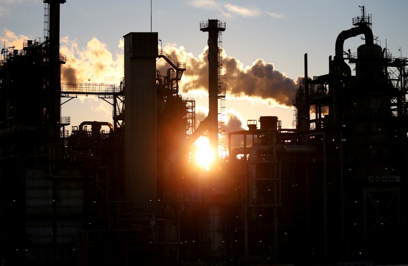 FILE PHOTO: Smoke rises from a factory during sunset at Keihin industrial zone in Kawasaki