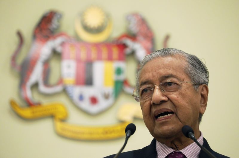 Malaysia's Interim Prime Minister Mahathir Mohamad speaks during a news conference in Putrajaya