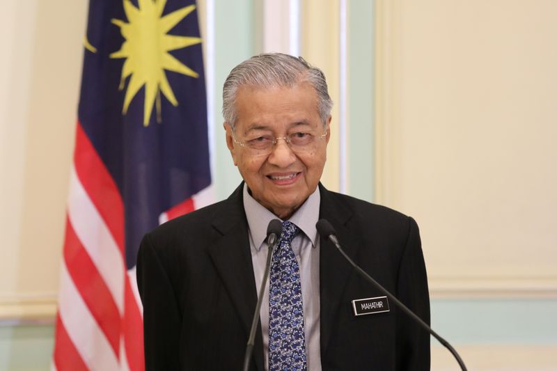 FILE PHOTO: Malaysia's Prime Minister Mahathir Mohamad speaks during a joint news conference with Pakistan's Prime Minister Imran Khan (not pictured) in Putrajaya