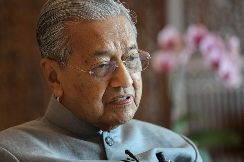 Malaysia's Prime Minister Mahathir Mohamad speaks during an interview with Reuters in Putrajaya