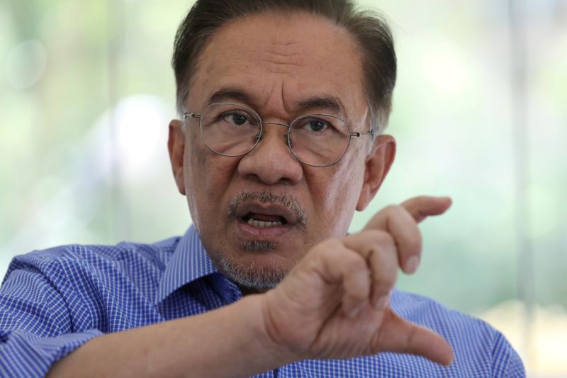 FILE PHOTO: Malaysia's politician Anwar Ibrahim speaks during an interview with Reuters in Petaling Jaya