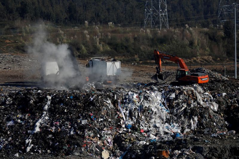 FILE PHOTO: Trucks with garbage are seen at the Recivalongo landfill in Sobrado