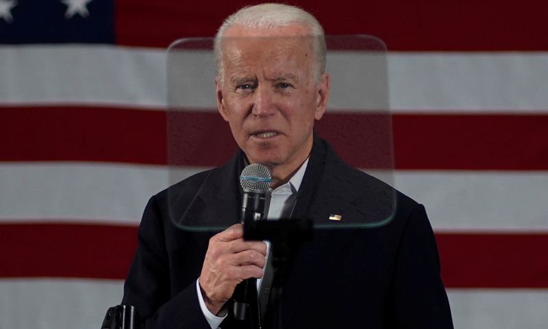 Democratic presidential candidate and former Vice President Joe Biden is framed by a teleprompter screen as he speaks at a campaign event in Concord