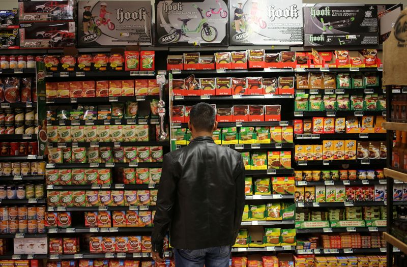 FILE PHOTO: A shopper looks at items at a grocery store in Johannesburg, South Africa