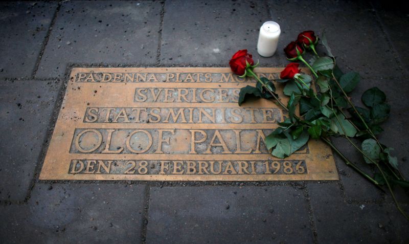 FILE PHOTO: Roses are laid on a plaque marking the location where Swedish Prime Minister Olof Palme was killed in Stockholm