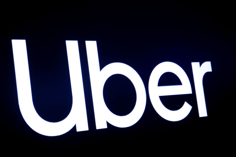 FILE PHOTO: A screen displays the company logo for Uber Technologies Inc on the day of its IPO at the NYSE in New York