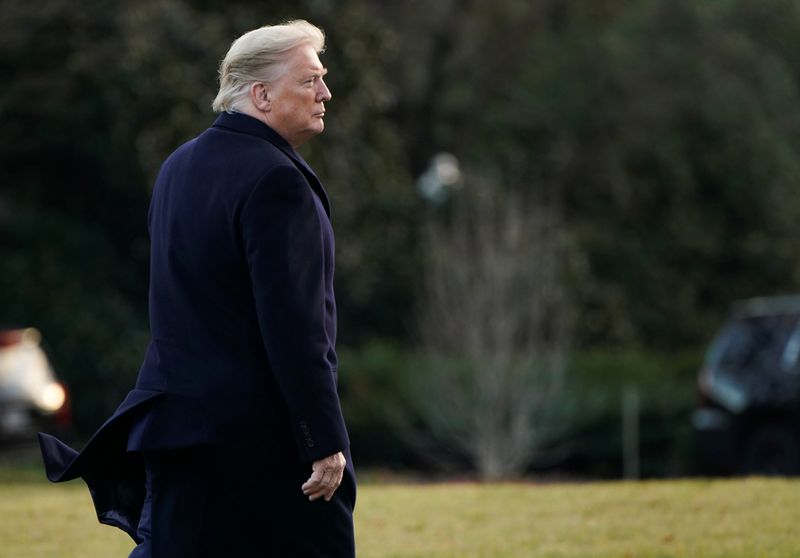 U.S. President Donald Trump walks to the Oval Office in Washington