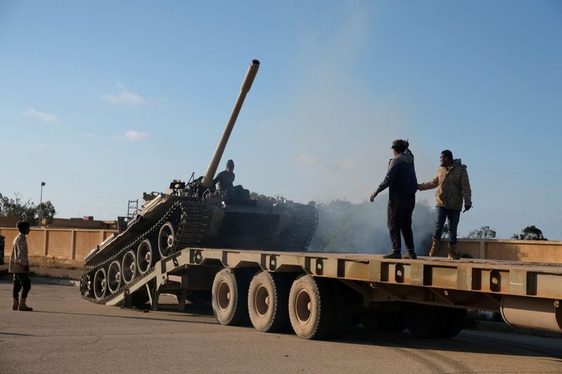 Members of Libyan National Army (LNA) commanded by Khalifa Haftar, get ready before heading out of Benghazi to reinforce the troops advancing to Tripoli, in Benghazi