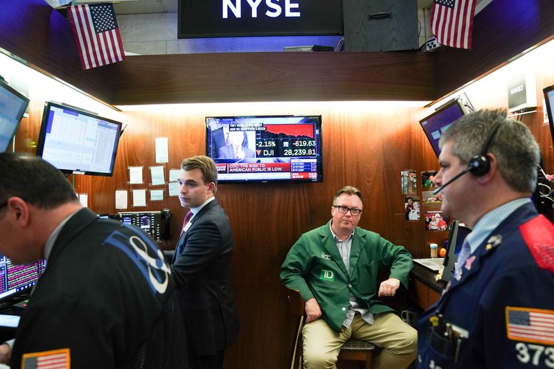 Traders work at the New York Stock Exchange