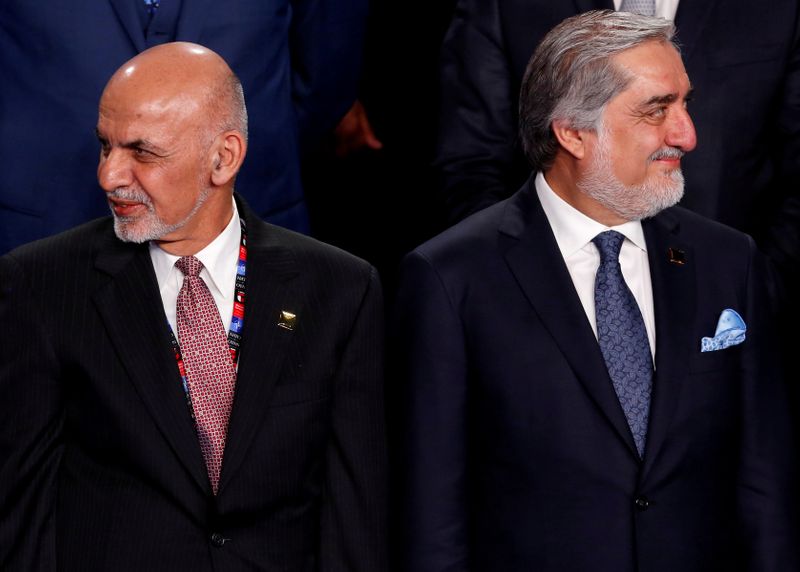 FILE PHOTO: FILE PHOTO: Ghani and Abdullah participate in a family photo with Ghani and Abdullah at the NATO Summit in Warsaw, Poland