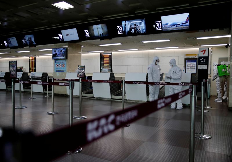 South Korean soldiers carry out disinfection work at the international airport amid the rise in confirmed cases of coronavirus disease (COVID-19) in Daegu