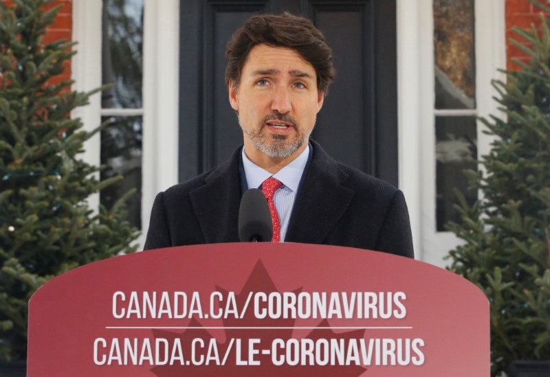 Canada's Prime Minister Justin Trudeau speaks to news media outside his home in Ottawa