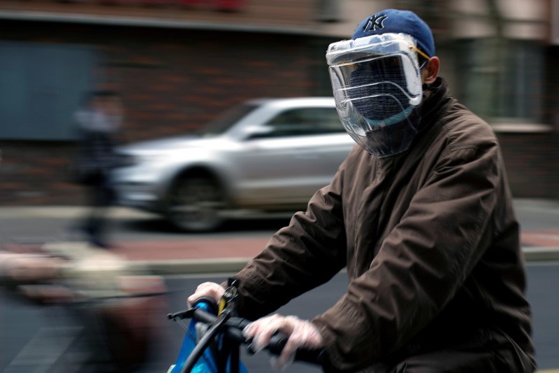 Man wears a protective face mask on the street following an outbreak of the novel coronavirus disease (COVID-19), in Shanghai