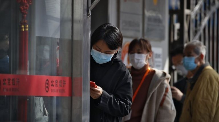 Chinese province at coronavirus center lets some companies reopen