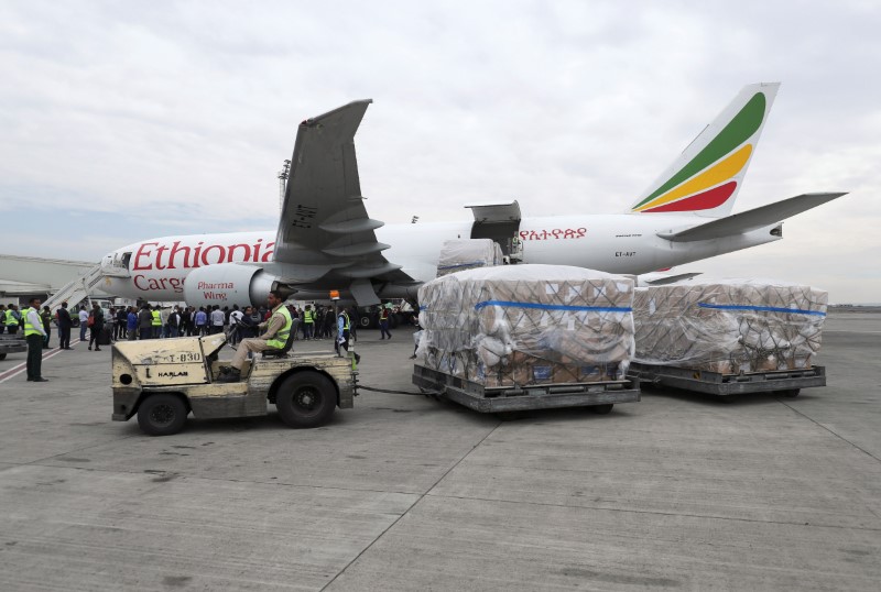Ethiopian Airlines worker transports a consignment of medical donation from Chinese billionaire Jack Ma and Alibaba Foundation to Africa in Addis Ababa